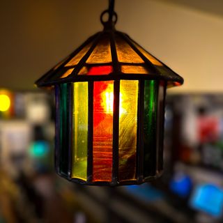 A multicoloured stained glass light at the Green Dragon in Bungay